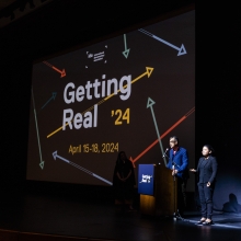 Abby Sun (Director of Artist Programs, IDA) and Dominic Asmall Willsdon (Executive Director, IDA) on the stage at the closing night of Getting Real ’24 conference.