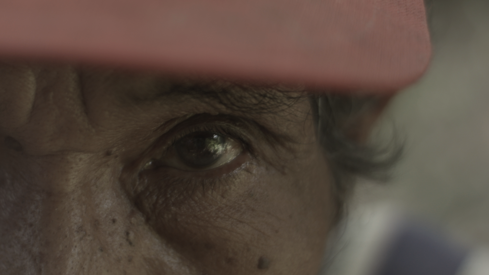 Still from 'Searching for Onoda.' Ricardo Nunez, from the farming town of Burol, who survived an Onoda attack but came away from it with a permanent limp. Photo credit: Mia Stewart.