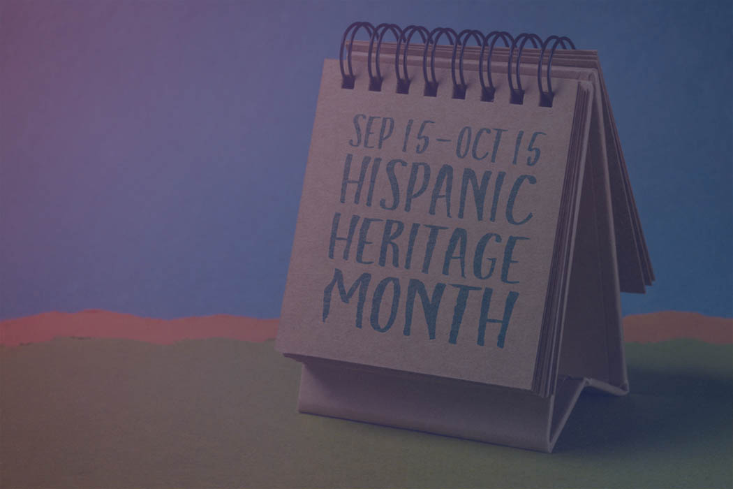 Notebook with the text Sep 15-Oct 15 Hispanic Heritage Month written in black text.