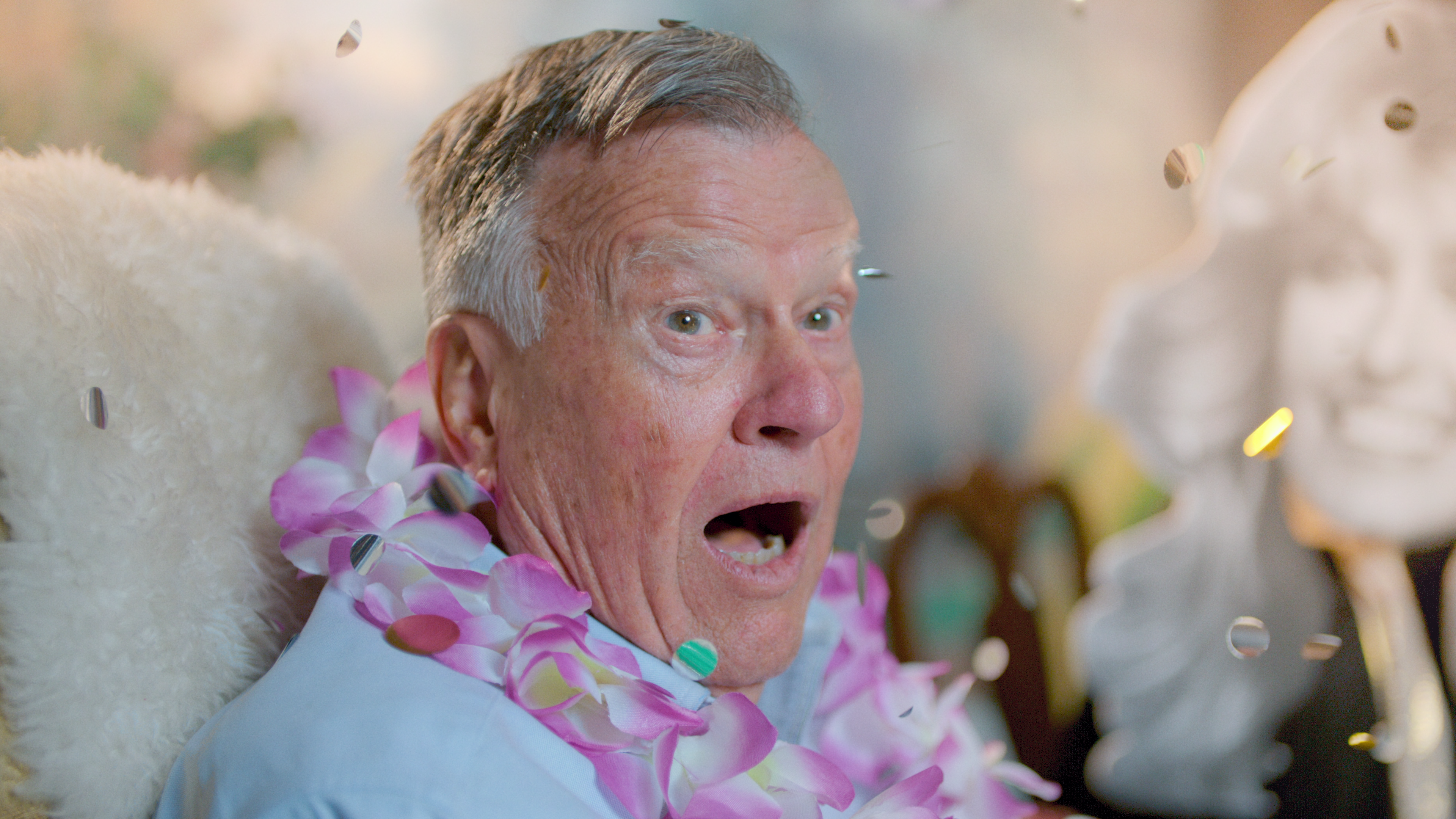 An older man gasps at the camera.
