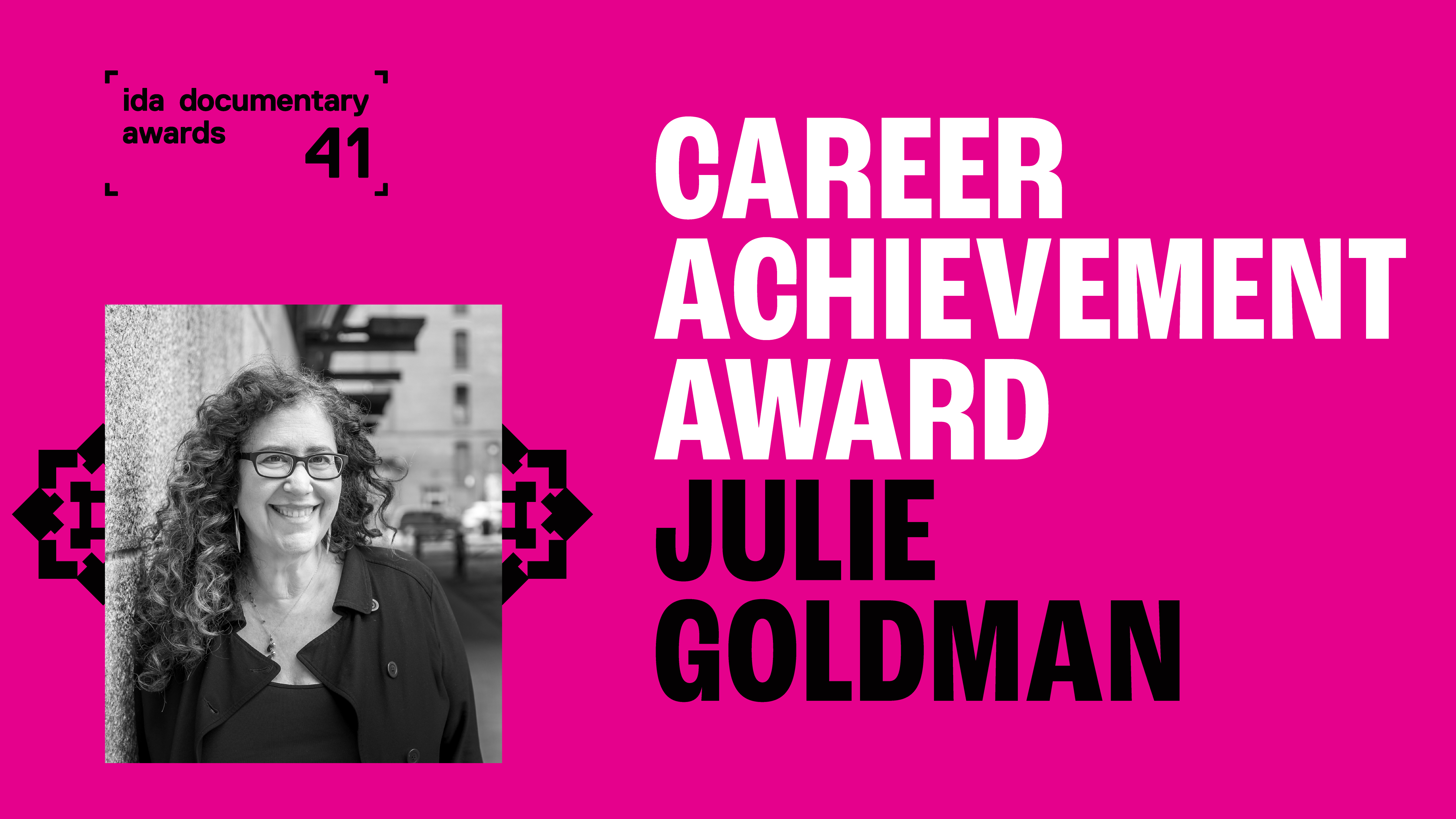Pink and Black. Career Achievement Award Julie Goldman. Headshot of Julie Goldman.
