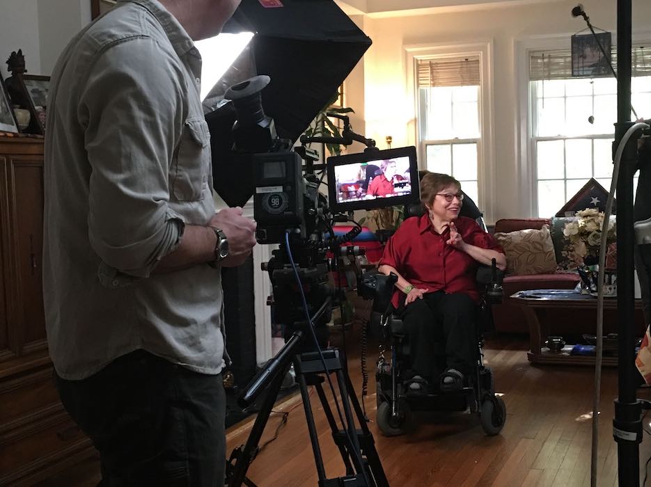 A BTS photo of Judy being filmed for "Crip Camp," being filmed by camera person Justin Schein. Photo source: Jim LeBrecht