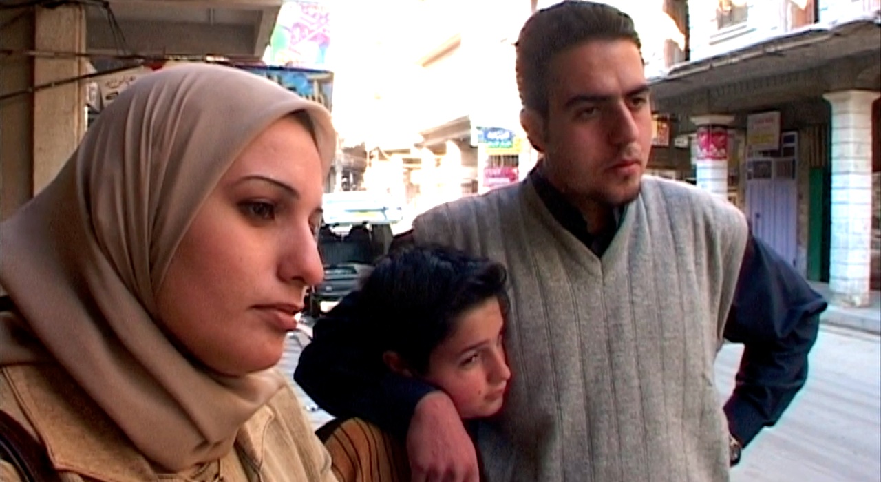 A family looks to the right.