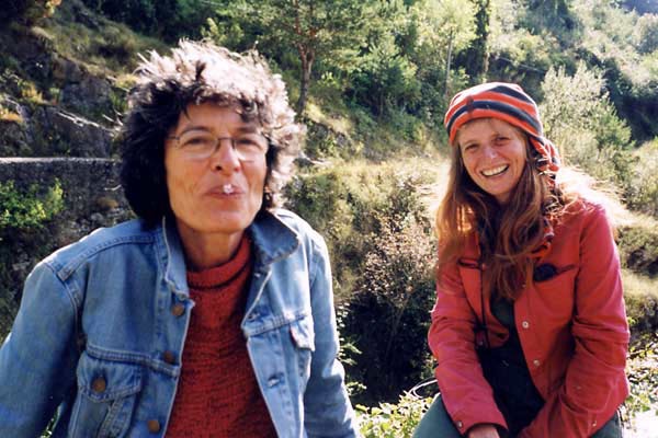 Two women smile at the camera.