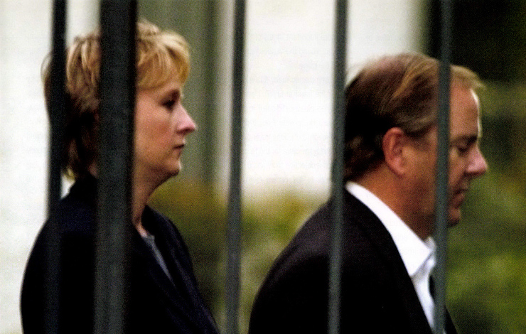 A handcuffed Jeffrey Skilling (right), former president of Enron, is escorted from FBI headquarters in Houston by an unidentified agent on Thursday, February 19, 2004 after surrendering to face criminal charges related to the company's collapse. From Alex Gibney's 'Enron: The Smartest Guys in the Room.' Photo: Pat Sullivan/AP