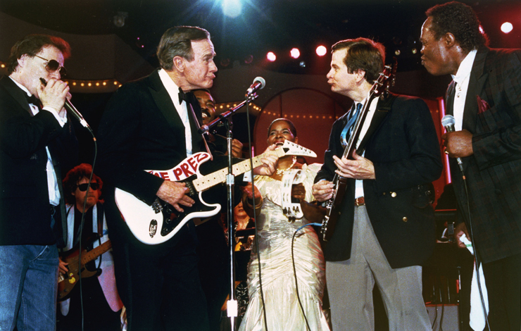 US President George Bush (left) trades looks with Lee Atwater, chairman of the Republican National Committe, as they accompany a blues band at inaugural Ball in Washington DC, on January 21, 1989. From Stefan Forbes' <em>Boogie Man: The Lee Atwater Story</em>