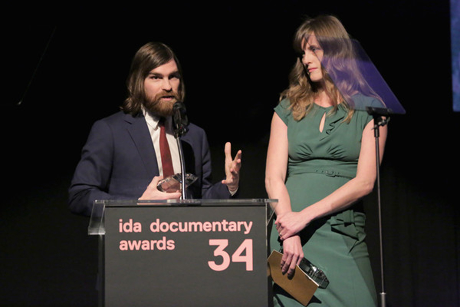 Andy Mills and Larissa Anderson, winners of the first Best Audio Documentary Award for 'Caliphate' speak onstage during the 2018 IDA Documentary Awards. Photo by Rebecca Sapp