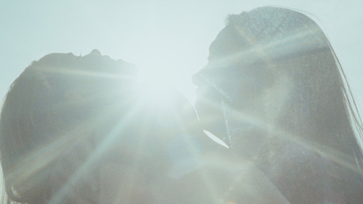From Ondi Timoner's 'Coming Clean.' From the film, which address the opioid addiciton crisis, a mother and her daughter embrace in the glare of sunlight.