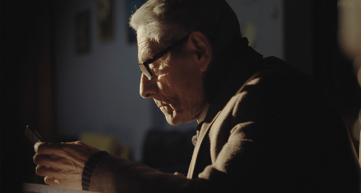 Sergio Chamy is an elderly Chilean man, seen here looking at a cellphone screen. From  Maite Alberdi’s Academy Award-nominated ‘The Mole Agent.’ Courtesy of Gravitas Ventures.