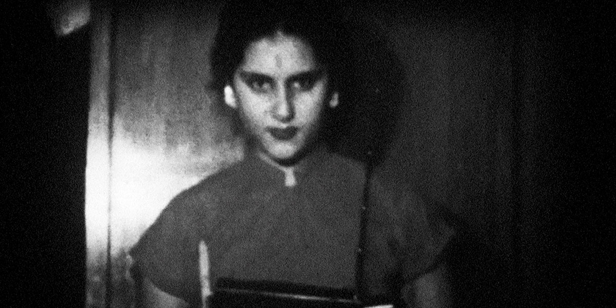 Black-and-white image of a young South Asian looking straight at the camera. From Payal Kapadia’s ‘A Night of Knowing Nothing.’ Courtesy of TIFF