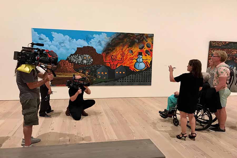 Filmmakers of 'Wojnarowicz: F**k You F*ggot F**ker' filming participants at the opening of the David Wojnarowicz retrospective at the Whitney Museum. Courtesy of Chris McKim