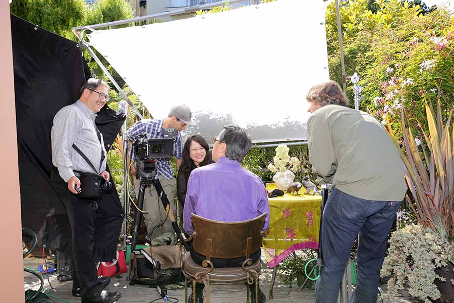 The filmmaker preparing to film an interview outdoors for 'Like a Rolling Stone: The Life and Times of Ben Fong-Torres.' Courtesy of Suzanne Kai