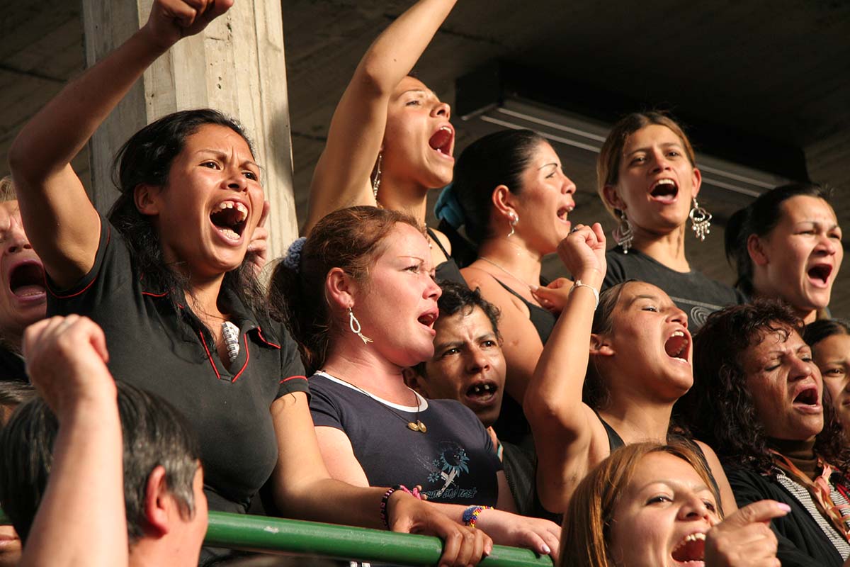 A group of Latinx women in stands, cheering. From Amanda Micheli and Isabel Vega’s 'La Corona,' which won the IDA Award for Best Documentary Short. Micheli won the David l. Wolper Student Documentary Achievement Award in 1996 for Just for the Ride. Courtesy of Amanda Micheli