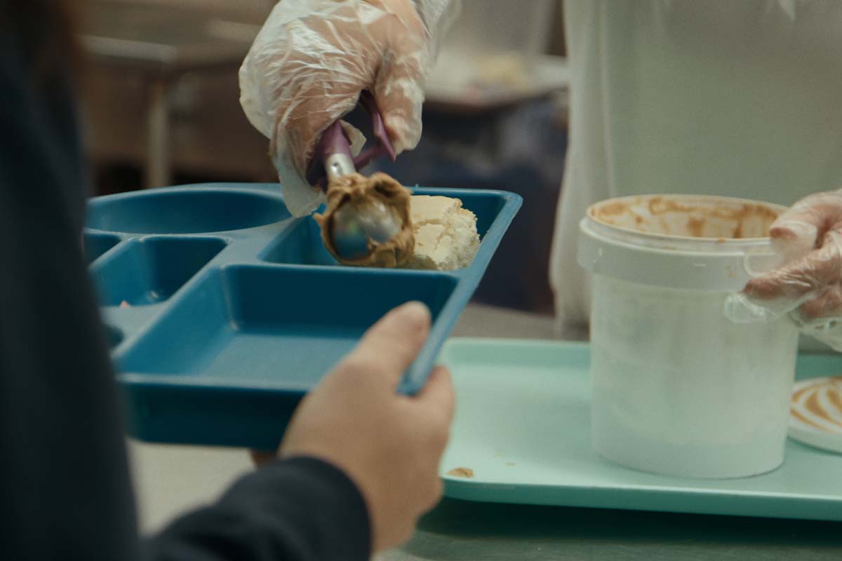 A close-up of the serving line of a cafeteria in a women's correctional facility. From Jennifer Redfearn and Tim Metzger's 'Apart,' which airs February 21 on 'Independent Lens.' Courtesy of the filmmakers.