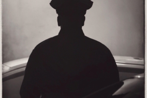 Police officer in silhouette.