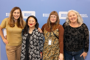 Four people stand in front of a BAVC Media step-and-repeat.