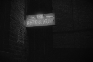 A grainy image displaying a neon sign reading “The Afterlight”.