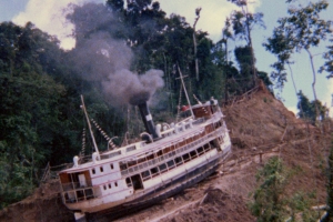 A large steamship being dragged up the side of a mountain.