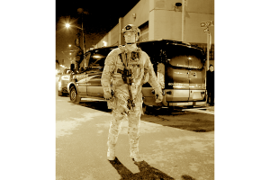 Sepia image of a sheriff in riot gear