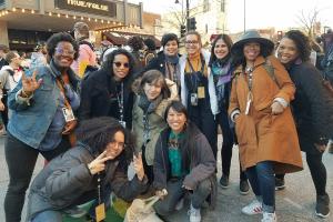 Iyabo Boyd (left), a Black woman with short hair and glasses, is standing with other women of color documentary professionals—all members of Brown Girls Doc Mafia—during True/False fest. Courtesy of Brown Girls Doc Mafia.