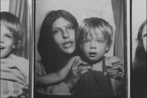 A black-and-white photo booth shot of a mother holding her toddler.  Images from Jonathan Caouette’s Tarnation. Courtesy of Wellspring Media