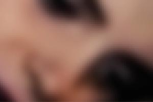 Pixelated abstract image of a woman's face.