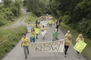 protesters from the town of Minden, WV hold signs about local contamination