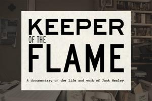 An office crowded with files and books with a white square over the office containing the title and subtitle: Keeper of the Flame, A documentary on the life and work of Jack Healey.
