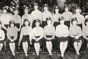 A large seated portrait of 18 WWII-era female military nurses