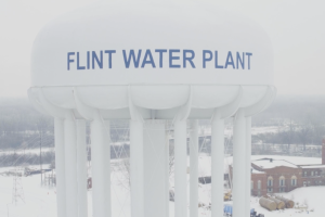 A photo of a water tank labeled 'Flint Water Plant' in the winter. 