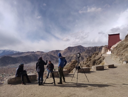 On the side of a mountain road, filmmakers prep for a shoot.