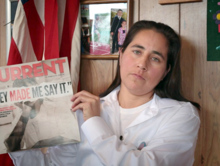 A woman holds up an issue of Current magazine.