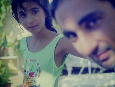 An aged-looking photo of a father and his young daughter 