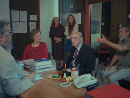 Group of men and women arguing at an office space