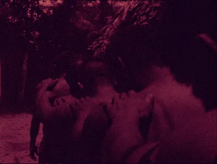 Four boys form a line with hands on each other's shoulders. Image is saturated in purple
