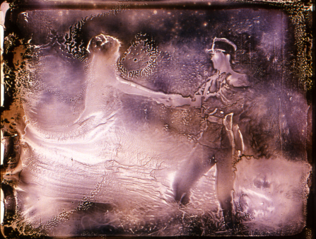 Heavily distorted pink image of a man in a soldier's uniform dancing with a woman whose shape is ambiguous and merges with light that has altered the image