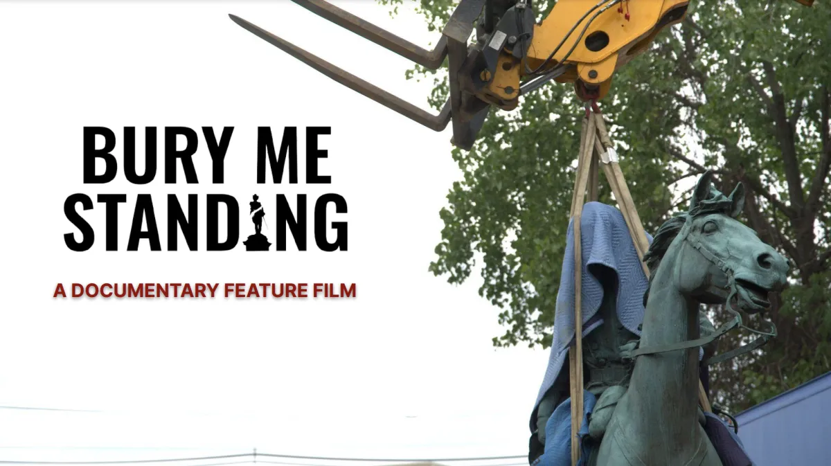 An image of a monument lifted by crane with large black title text reading “BURY ME STANDING” and maroon sub-title text reading "A DOCUMENTARY FILM”