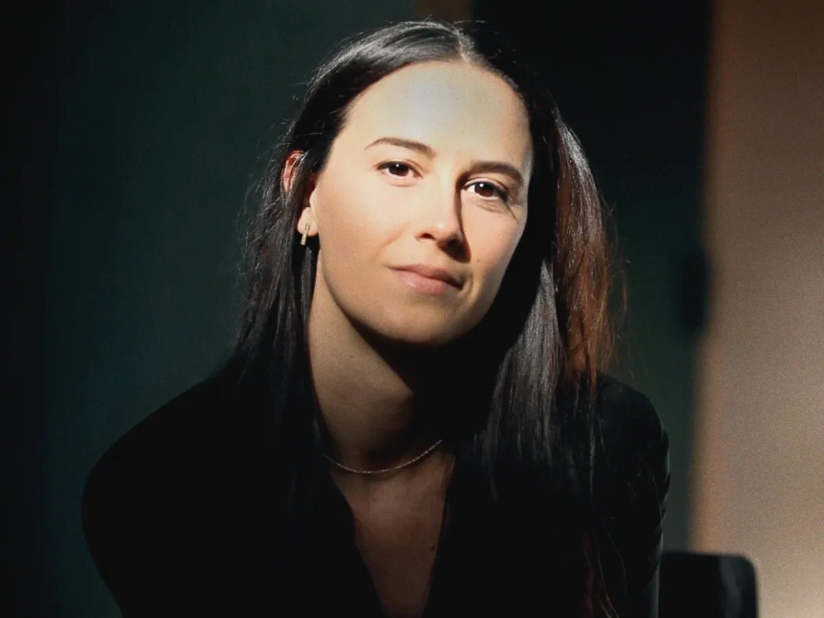 headshot of Caitlyn Greene wearing a black top