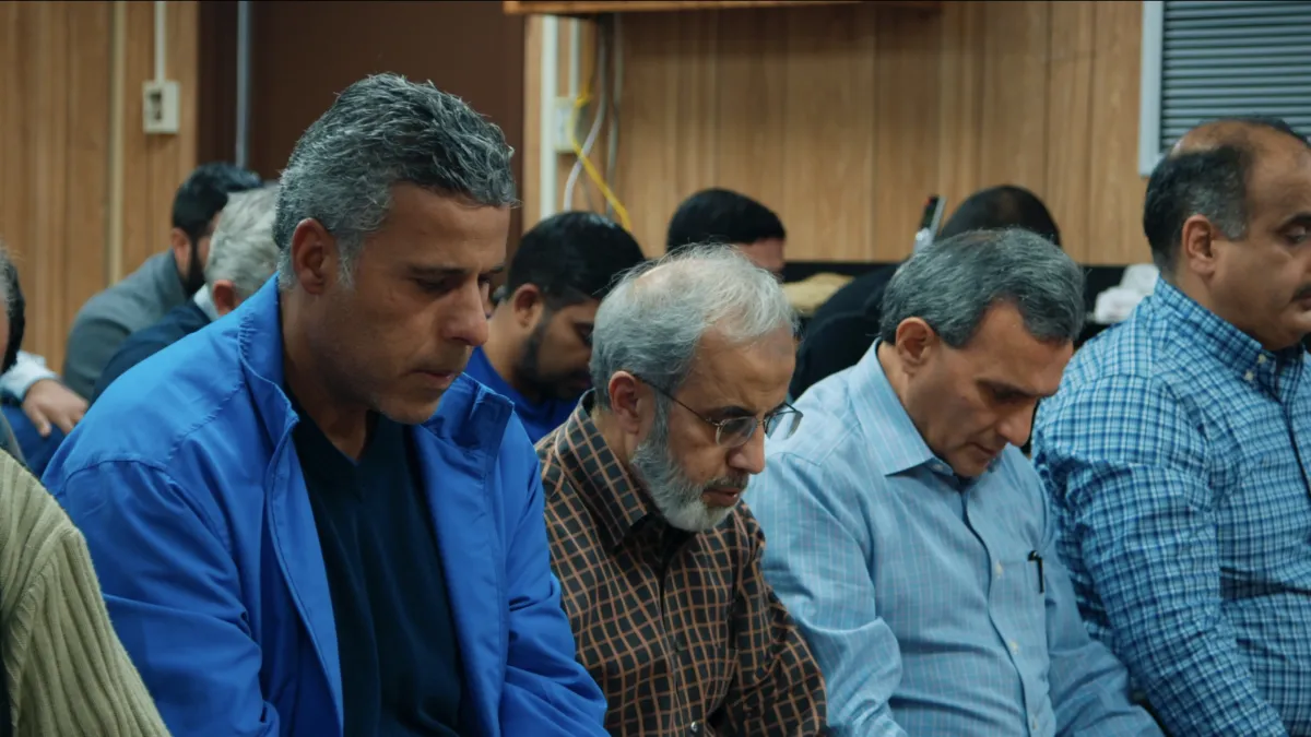 Attendees of the Victoria Islamic Center pray in a temporary building after an arson destroys their mosque.