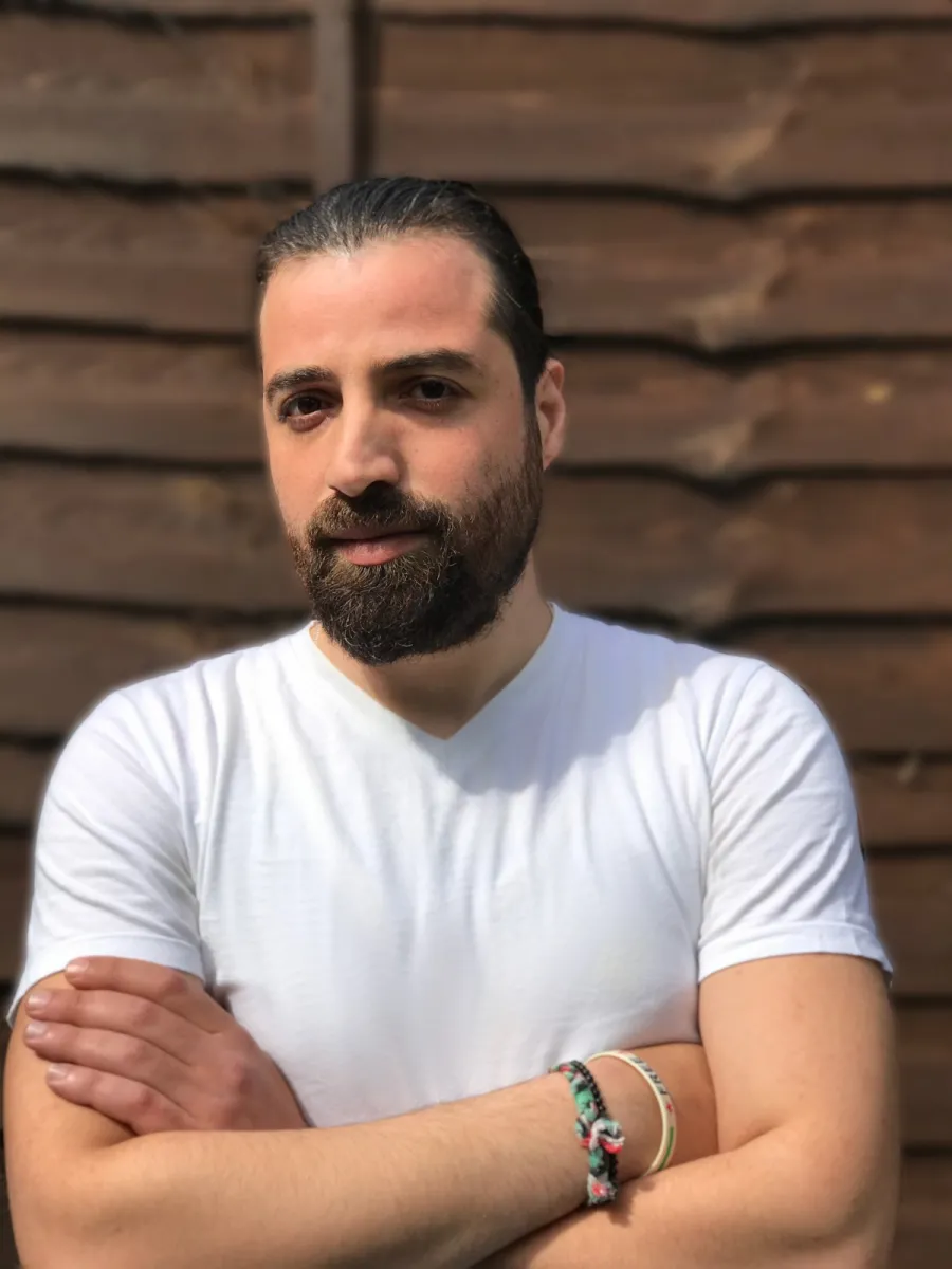 image of white man with brown beard and his arms crossed