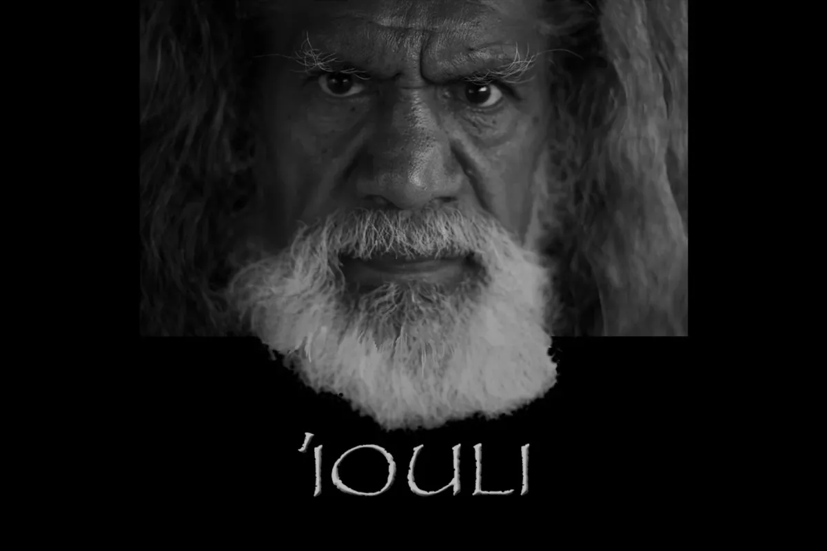 Black and white portrait of a man with long hair and a white beard. The text "'Iouli" below the portrait.