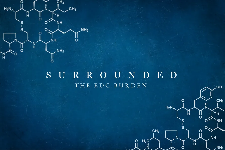 Title Surrounded - The EDC Burden in white lettering against a blue faded background. In the upper left corner and the lower right corner are images of chemical formulations.