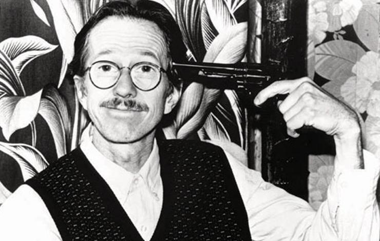A man wearing glasses gives a close-lipped smile while holding a gun to his temple, fromTerry Zwigoff's 'Crumb', about the iconoclastic underground cartoonist, screened in Berlin's Forum section. (Photo: Robert Crumb)