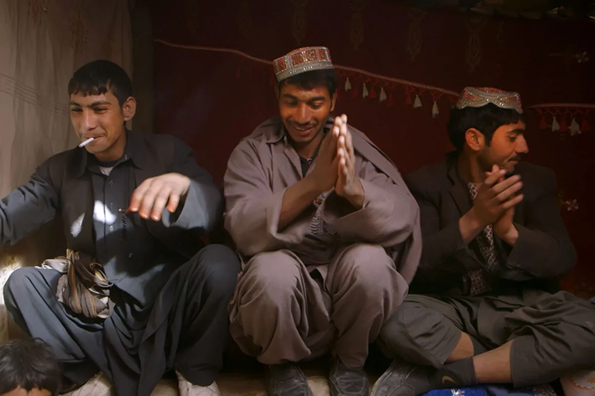 Shaista is a young Afghan man singing and dancing along with two other male friends in a refugee camp in Kabul. From Elizabeth and Gulistan Mirzaei’s Oscar-nominated short, ‘Three Songs for Benazir.’Courtesy of Netflix.