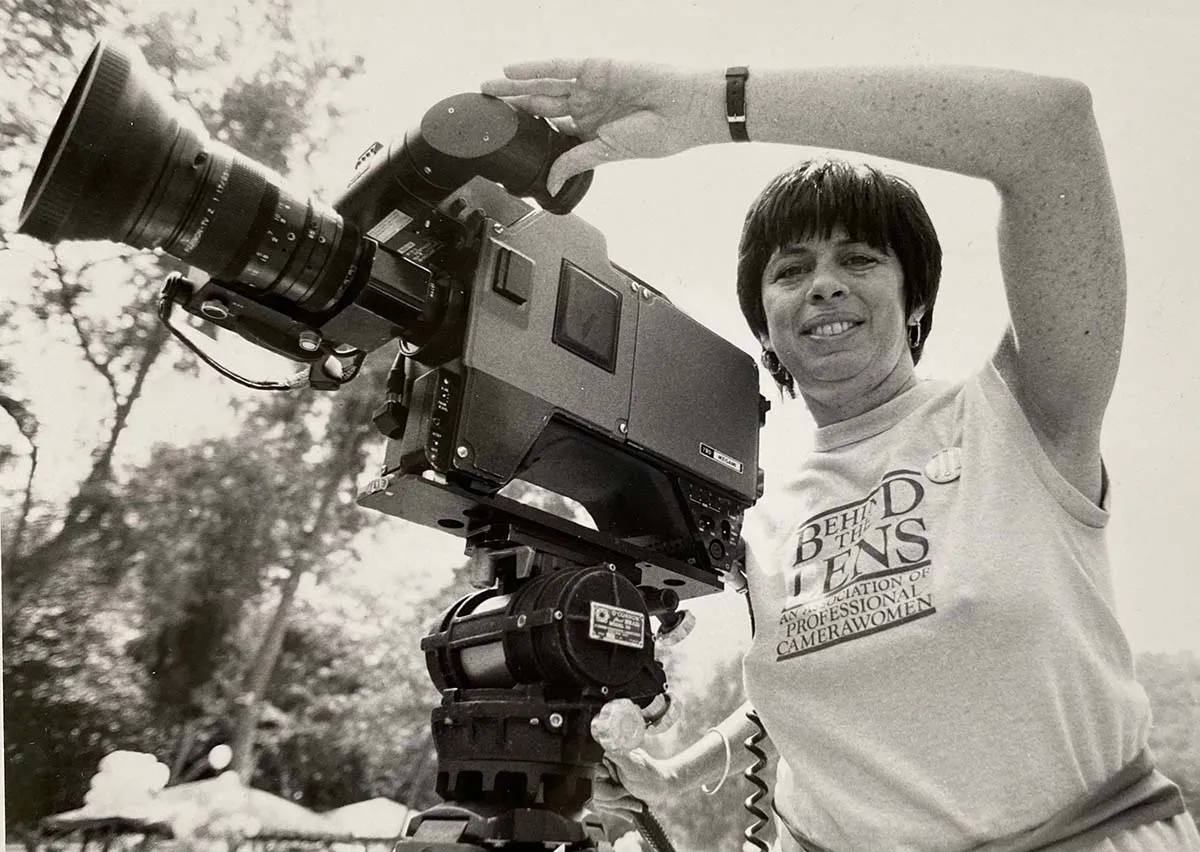 An Association of Professional Camerawomen member in the mid-1980s using a 1982 Ikegami HL-79D portable electronic camera.