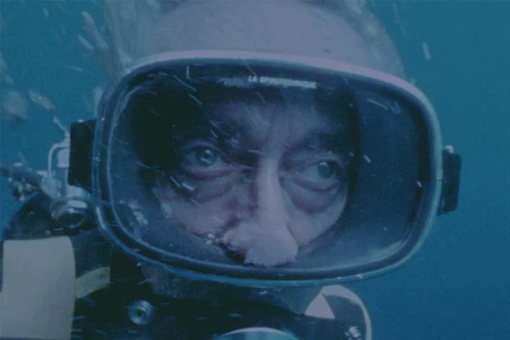 Film still of Jacques Costeau underwater in scuba diving gear. Courtesy of National Geographic