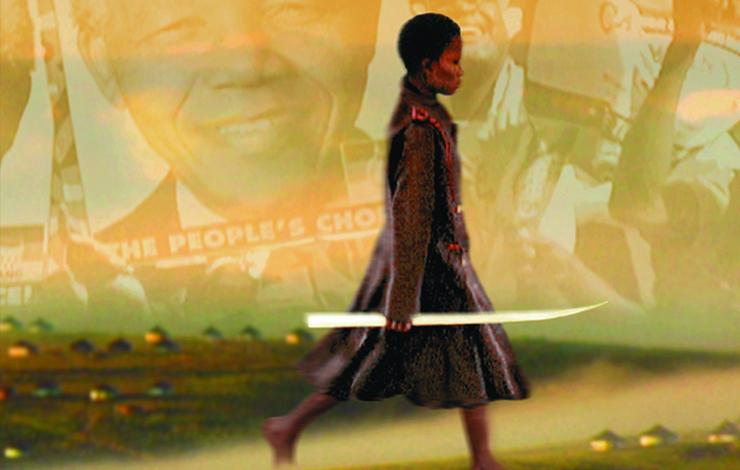 A woman walks with a photo of Nelson Mandela projected onto the background.
