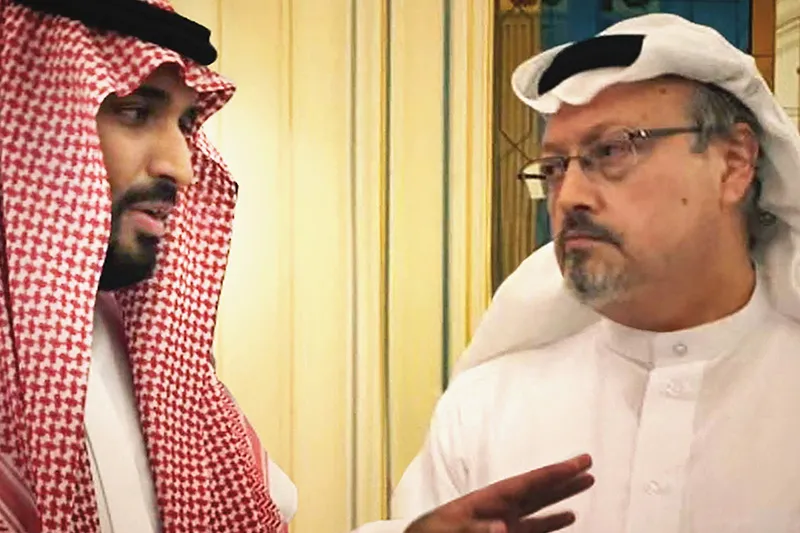 Two Saudi man in traditional robes are talking to each other