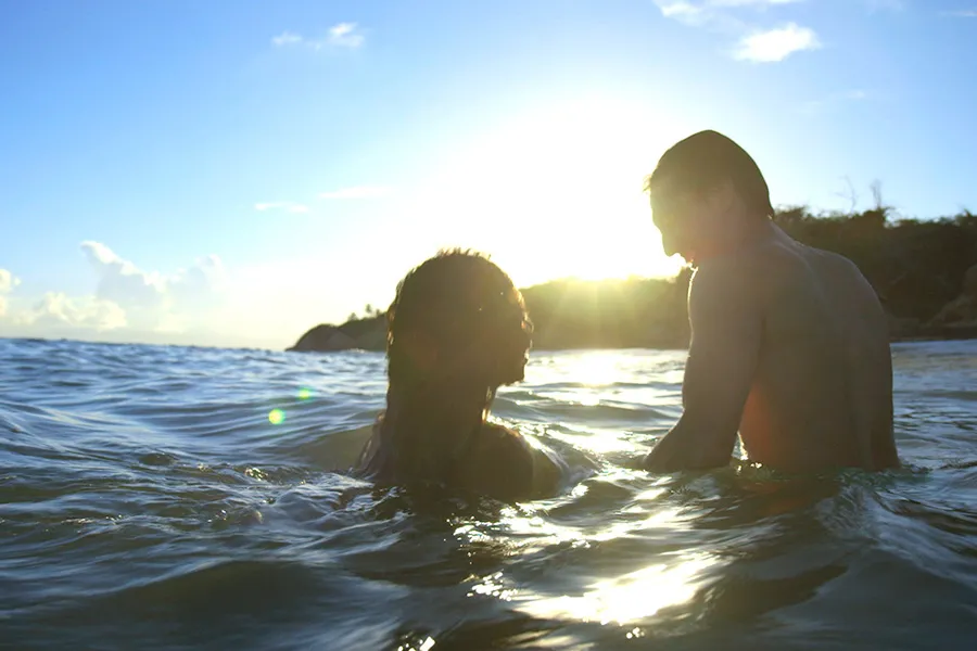 a person is swimming in a lake