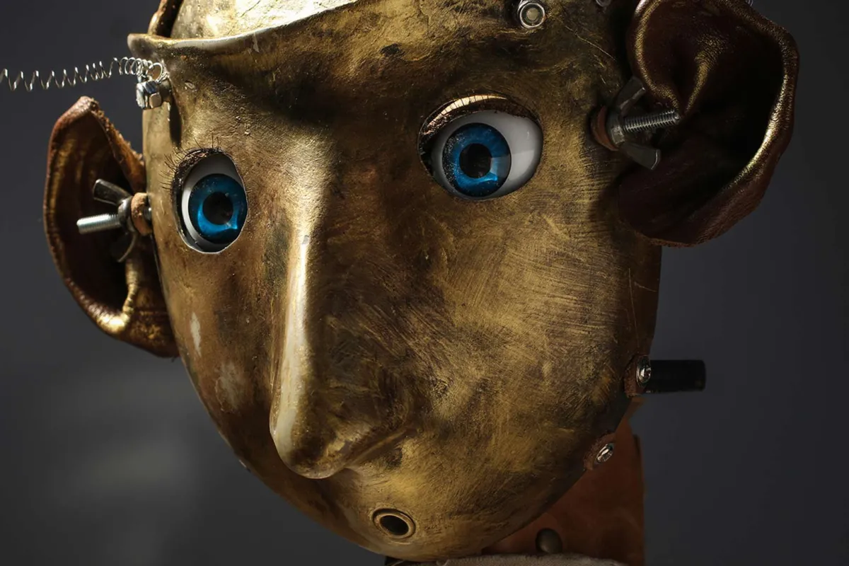 A metal sculpture of a head